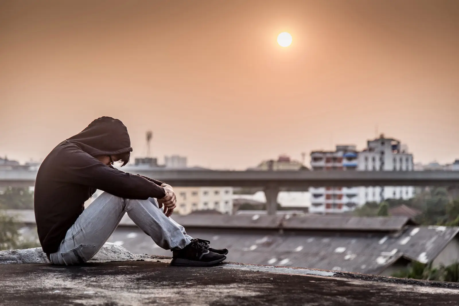 A frustrated boy on the roof