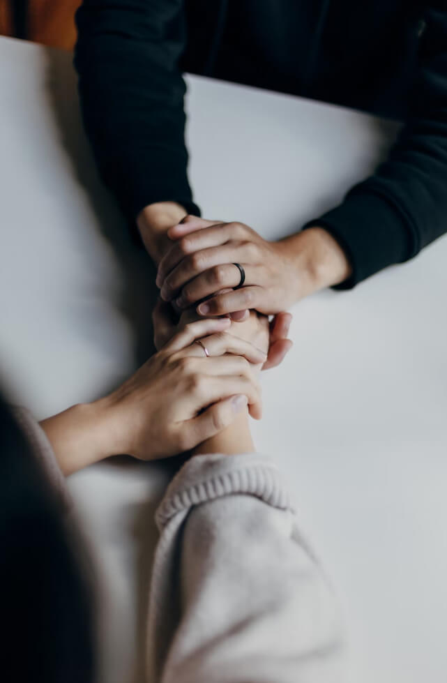 Man holding a woman's hands