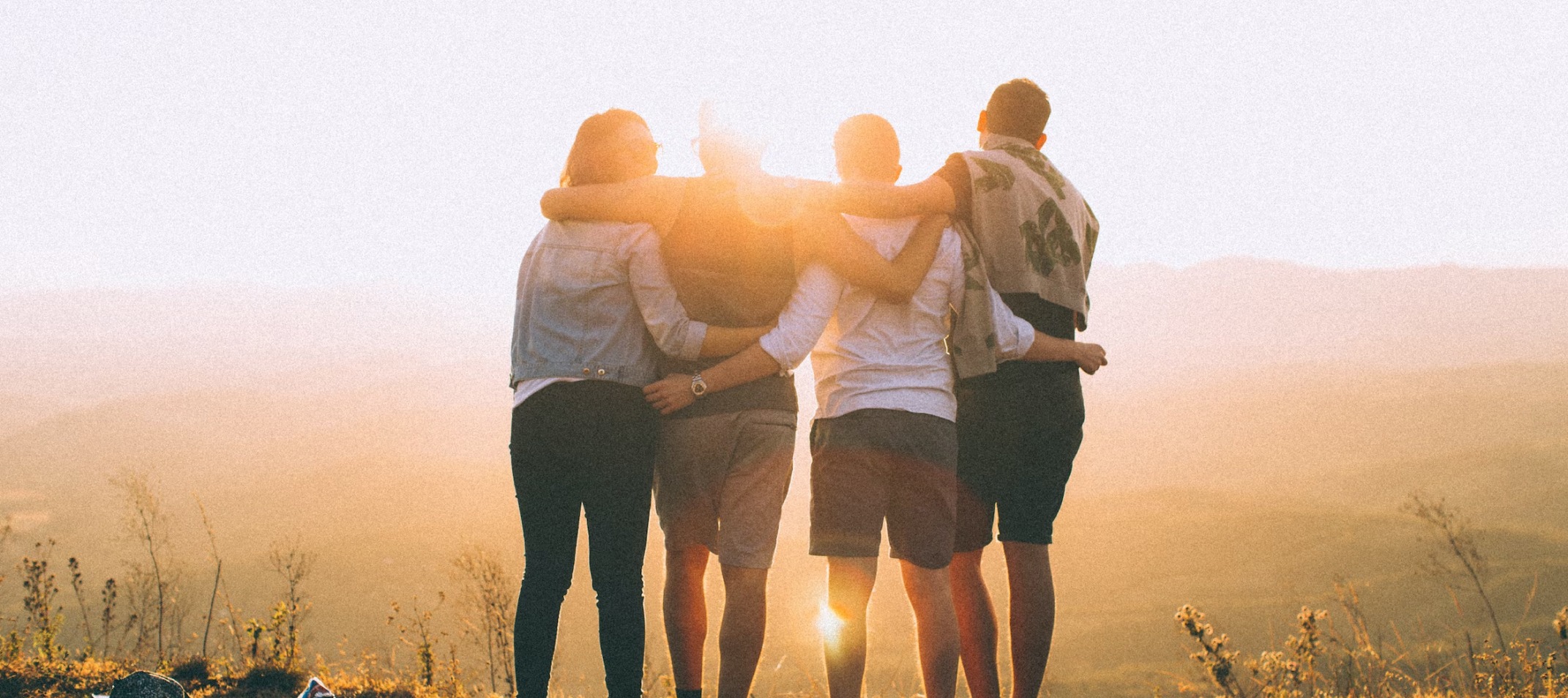 Men and women embrace at sober living Austin