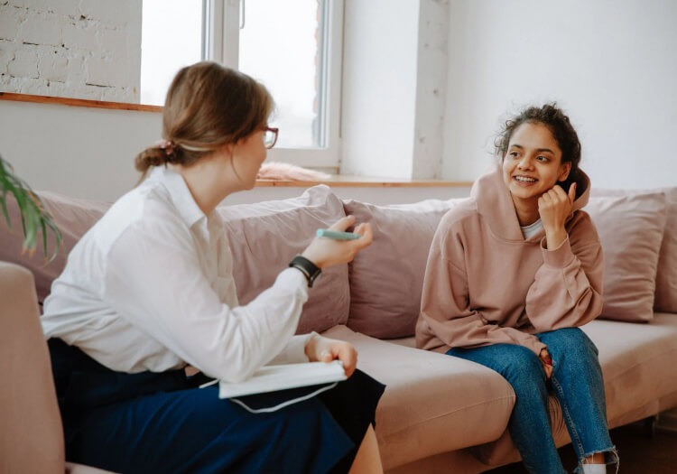 A child consults with a recovery specialist