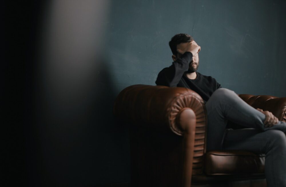 A frustrated man on the sofa