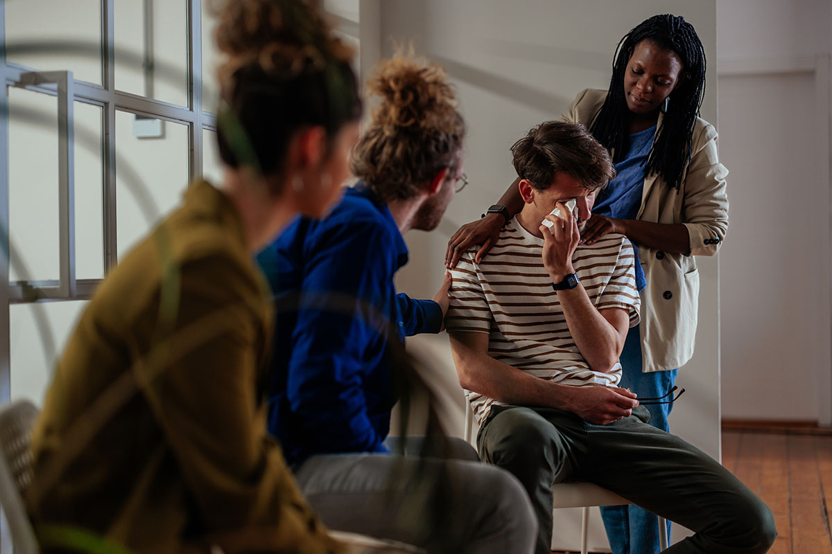 A group of people holding an intervention.