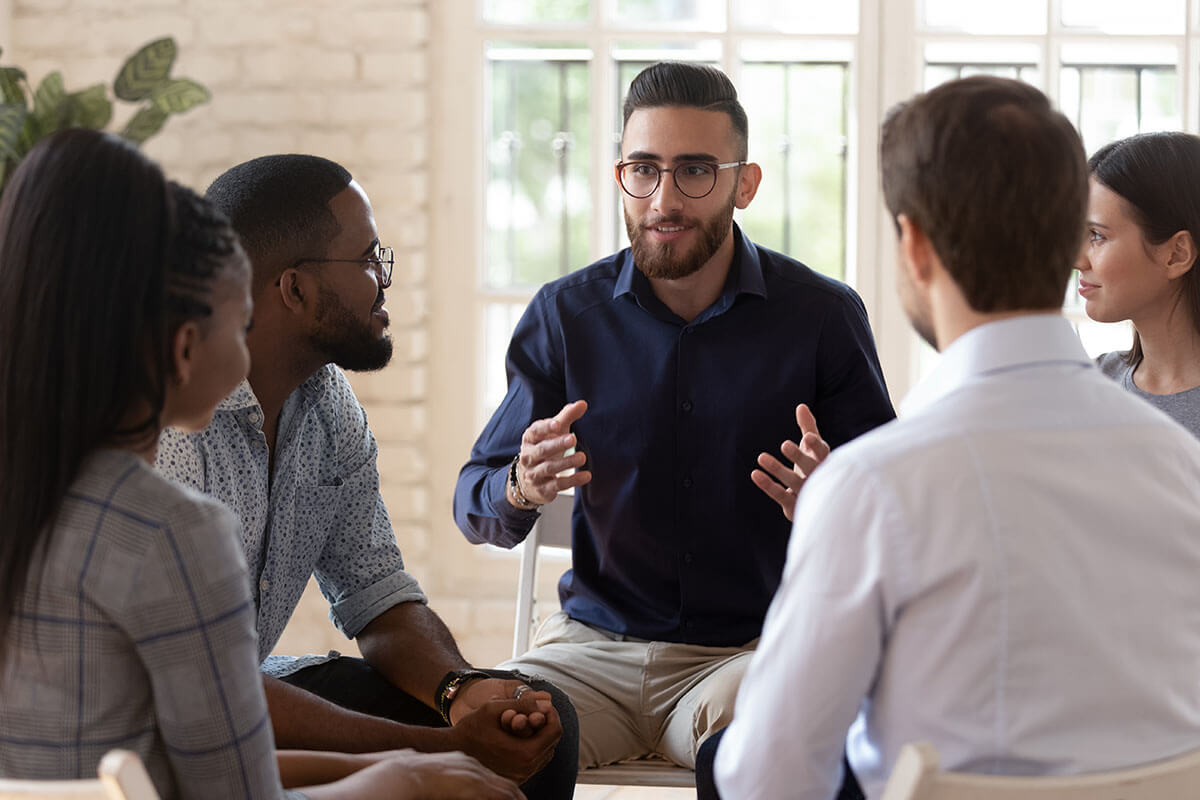 A man speaks in an addiction recovery support group.