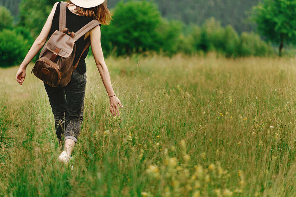 A person on a peaceful walk in a meadow 