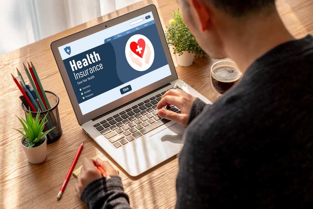 A person looking at health insurance on a laptop 